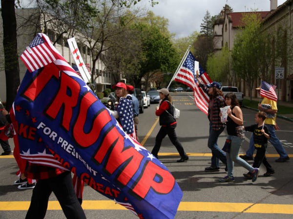 People march through Midtown Sacramento at a Trump rally in March 2017.